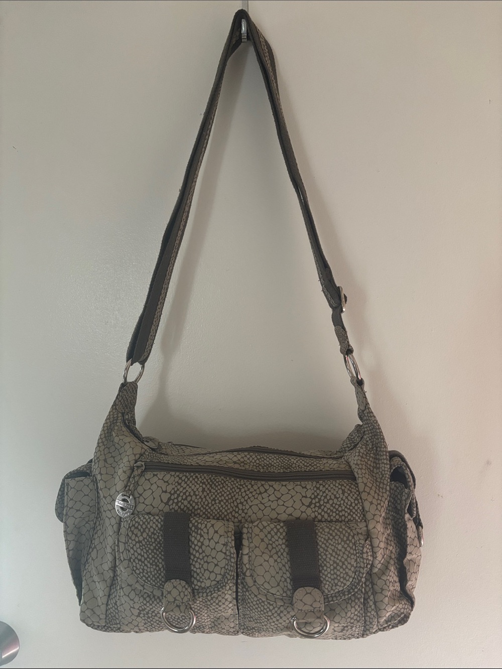 Travelon snakeskin pattern shoulder bag featuring silver-tone hardware